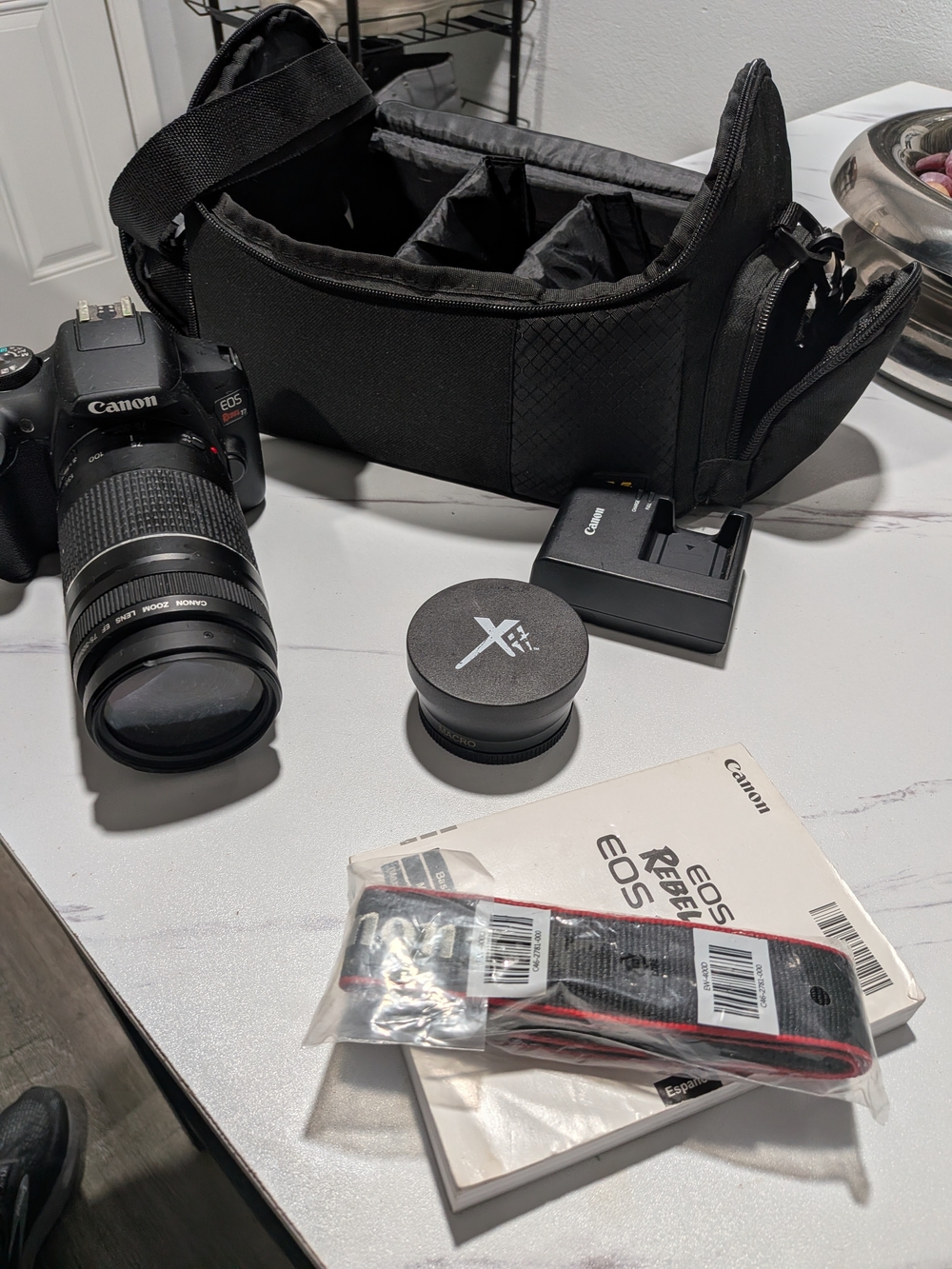 Canon black DSLR camera kit with black carry bag